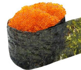 A piece of sushi with masago capelin roe caviar on top.