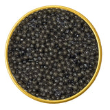 Close-up of a container with American Paddlefish Malossol Black Caviar on a white background