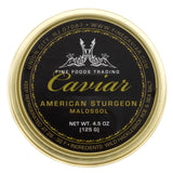 A tin can of American Sturgeon Caviar Container with black and gold label, net weight 4.5 oz. (125 g). View from top.
